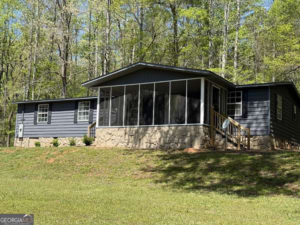 6.17 Acres of Land with Home for Sale in Arnoldsville, Georgia