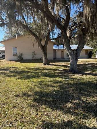 10.5 Acres of Land with Home for Sale in Moore Haven, Florida