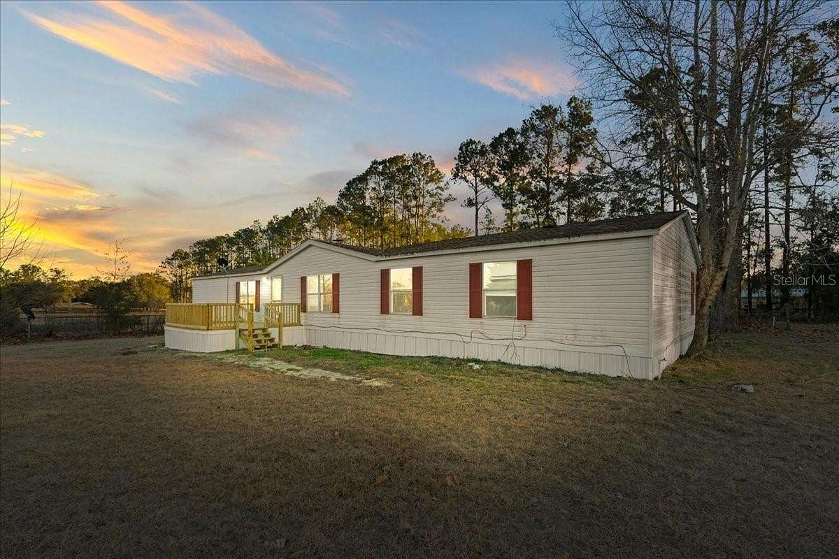 9.34 Acres of Land with Home for Sale in Archer, Florida