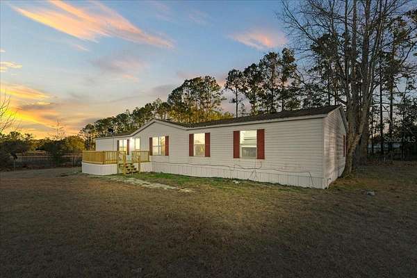 9.34 Acres of Land with Home for Sale in Archer, Florida