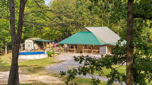 5.75 Acres of Land with Home for Sale in Oldfort, Tennessee