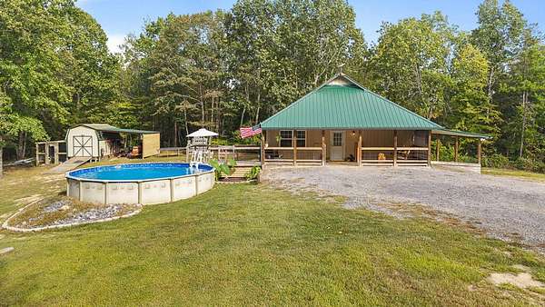 5.75 Acres of Land with Home for Sale in Oldfort, Tennessee