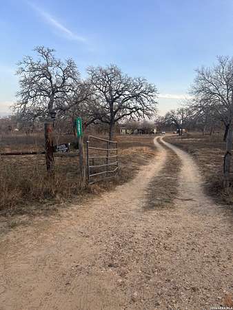 8.74 Acres of Land with Home for Sale in Floresville, Texas