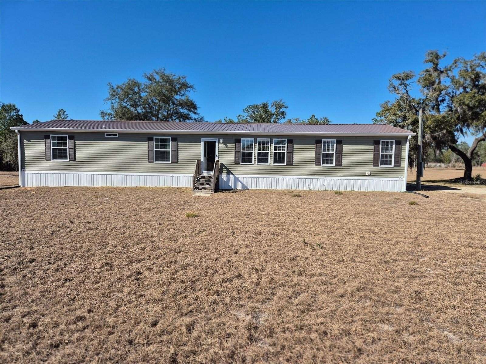 5 Acres of Residential Land with Home for Sale in Bronson, Florida