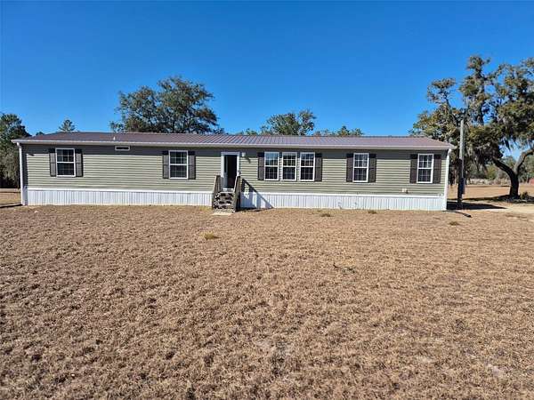 5 Acres of Residential Land with Home for Sale in Bronson, Florida