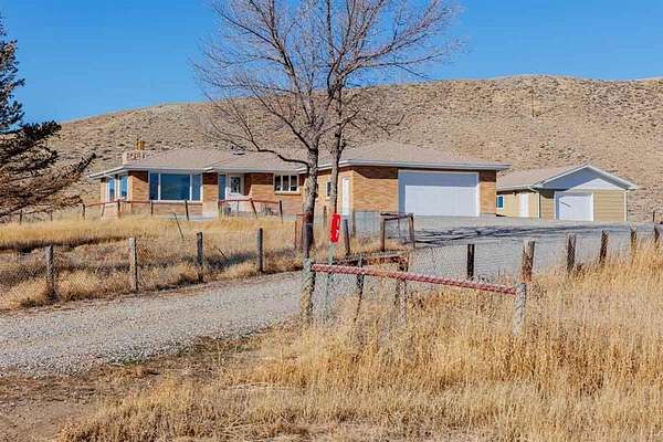 2.4 Acres of Residential Land with Home for Sale in Cody, Wyoming