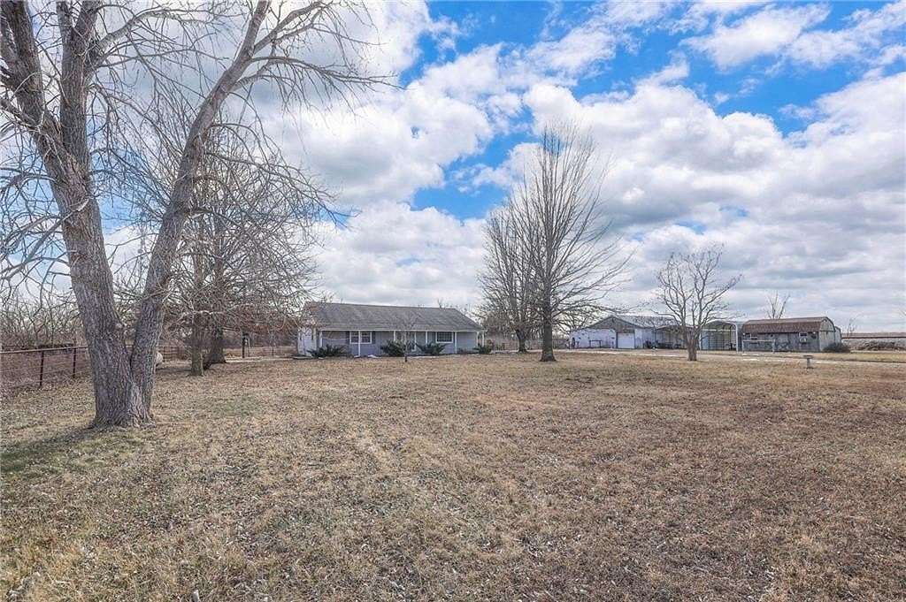 11 Acres of Land with Home for Auction in Harrisonville, Missouri