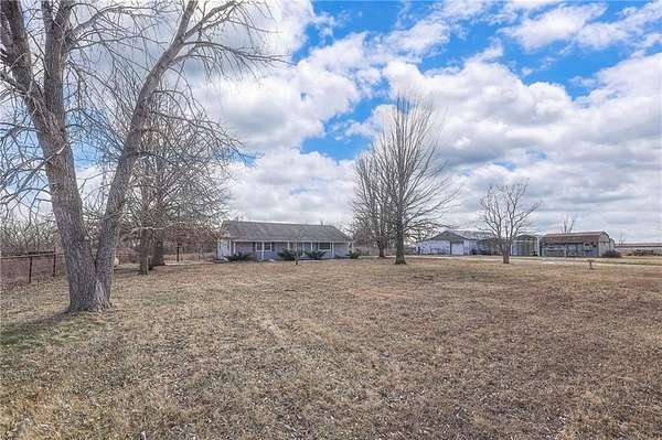 11 Acres of Land with Home for Auction in Harrisonville, Missouri