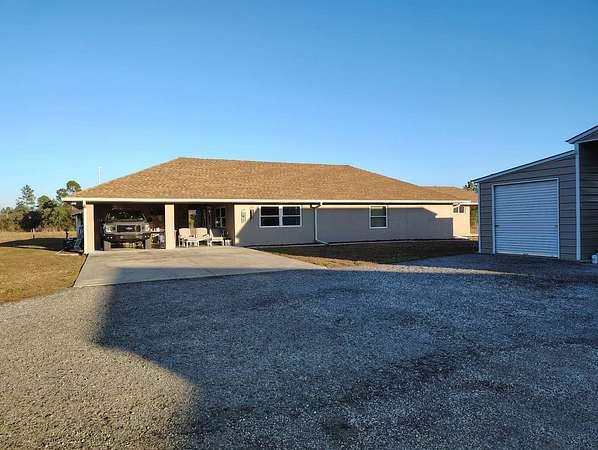 2.5 Acres of Residential Land with Home for Sale in New Smyrna Beach, Florida