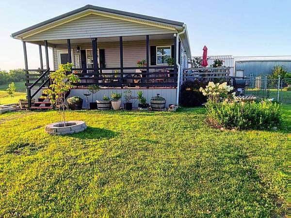 9.54 Acres of Land with Home for Sale in Rayville, Missouri