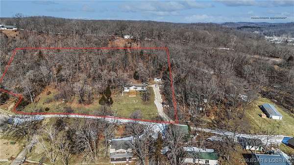 3.8 Acres of Residential Land with Home for Sale in Gravois Mills, Missouri