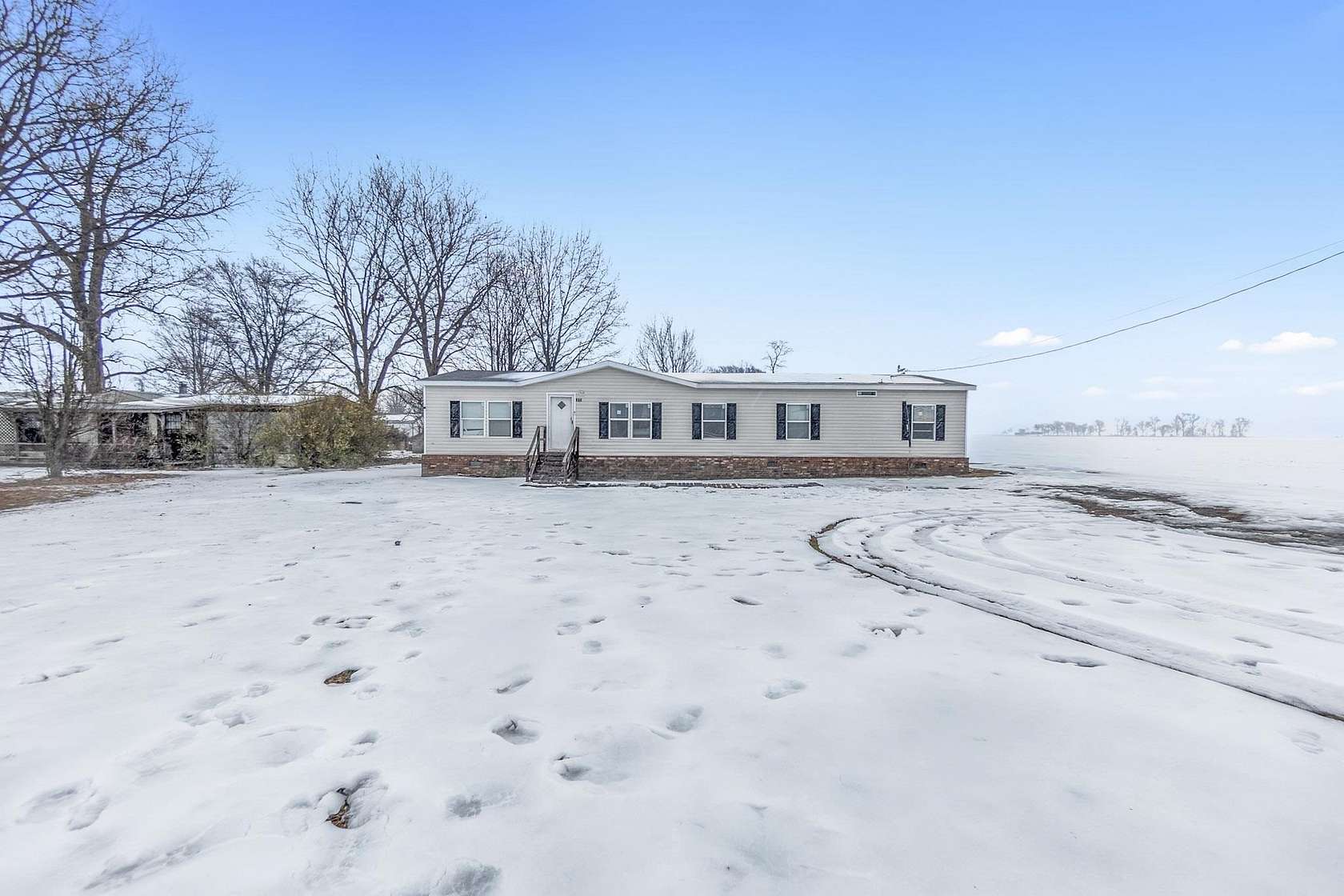 4.7 Acres of Residential Land with Home for Sale in Covington, Tennessee