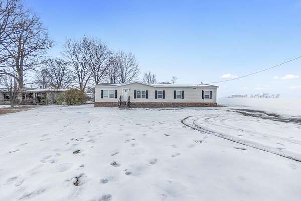 4.7 Acres of Residential Land with Home for Sale in Covington, Tennessee