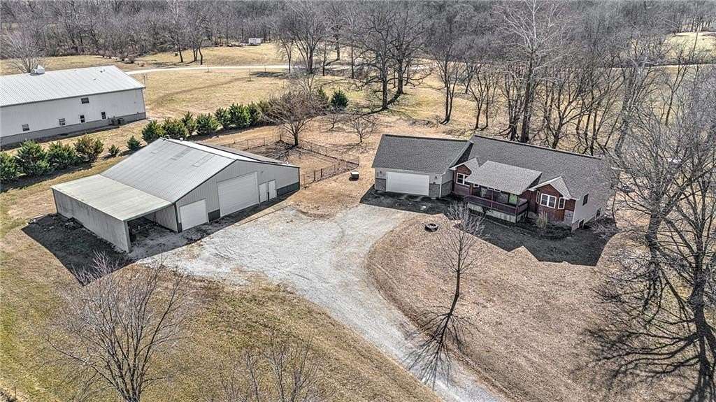 5 Acres of Residential Land with Home for Sale in Gravette, Arkansas