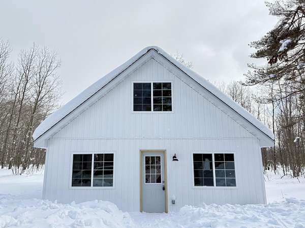 3 Acres of Residential Land with Home for Sale in Mancelona, Michigan