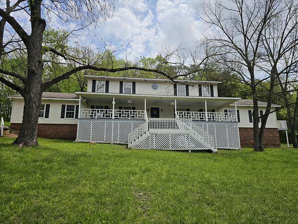 10 Acres of Residential Land with Home for Sale in Pineville, Missouri