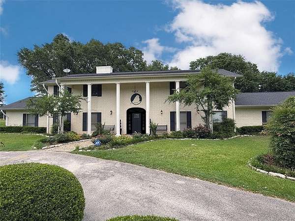 31.1 Acres of Agricultural Land with Home for Sale in Madisonville, Texas