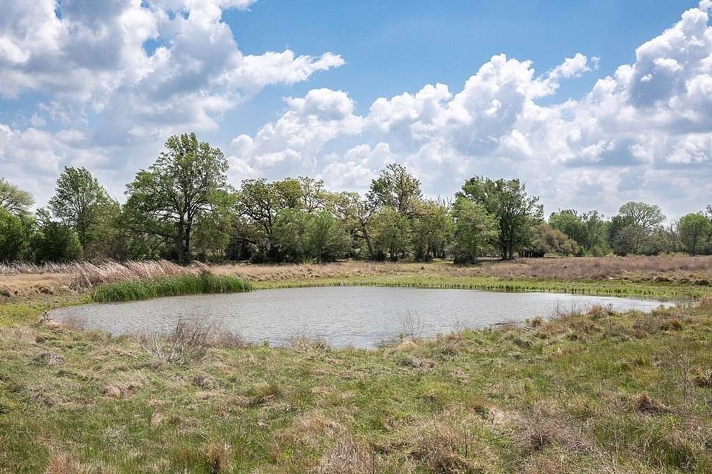 55.7 Acres of Agricultural Land with Home for Sale in Ledbetter, Texas
