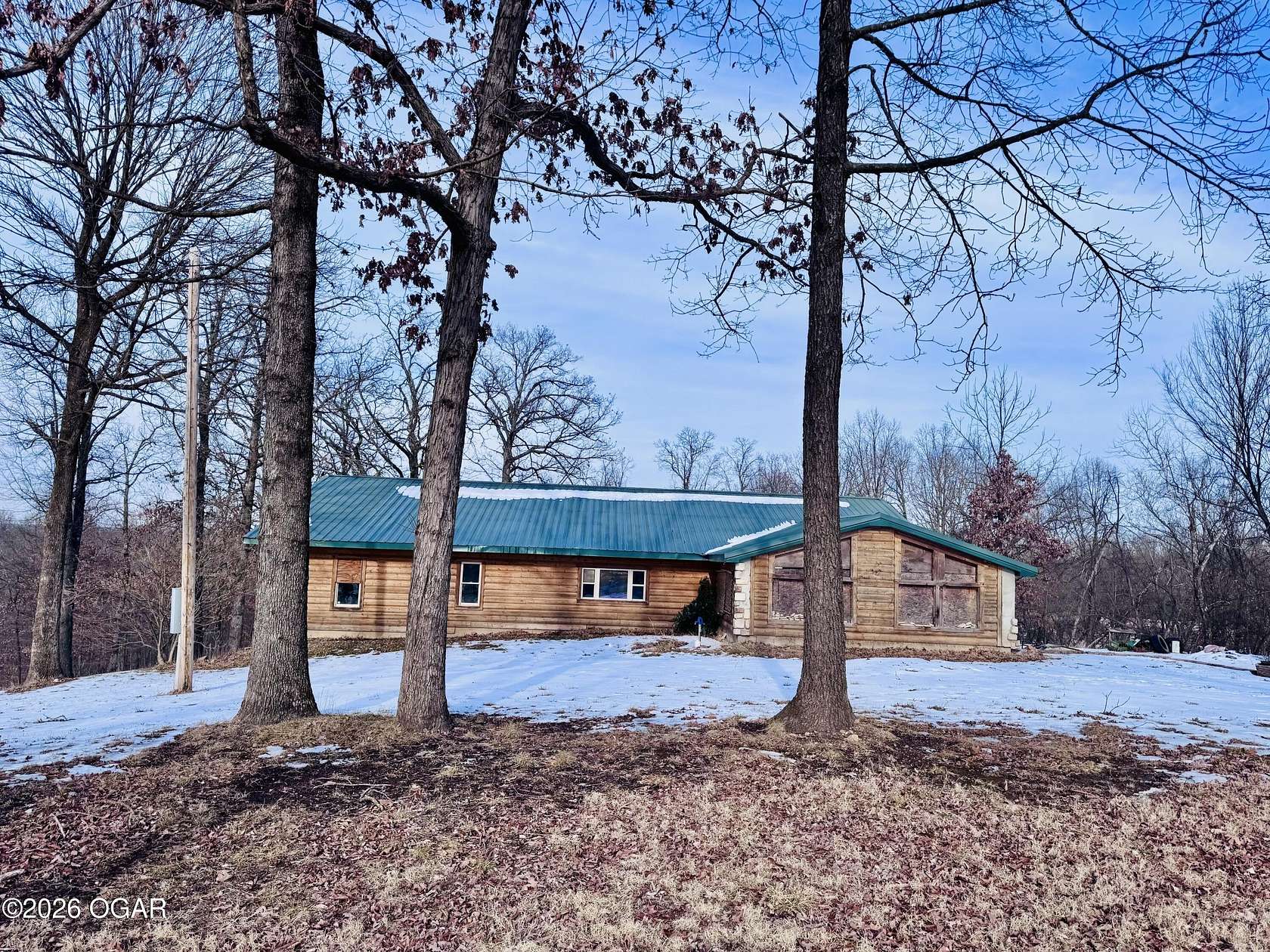 3 Acres of Residential Land with Home for Sale in Pineville, Missouri