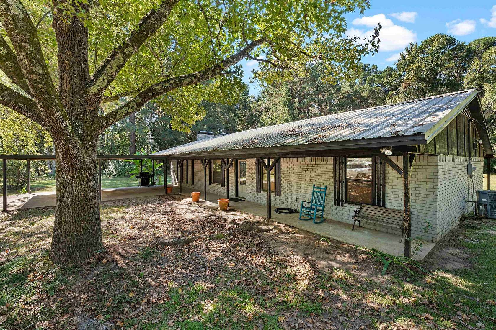 1.77 Acres of Land with Home for Sale in Carthage, Texas