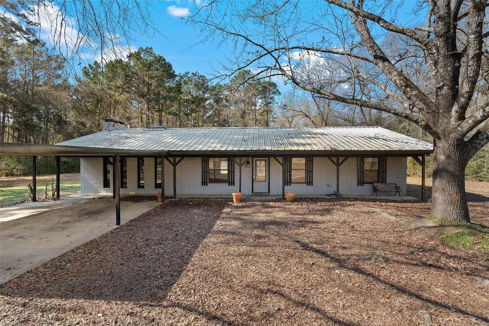 1.77 Acres of Land with Home for Sale in Carthage, Texas
