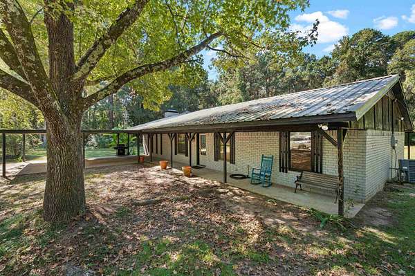 1.77 Acres of Land with Home for Sale in Carthage, Texas