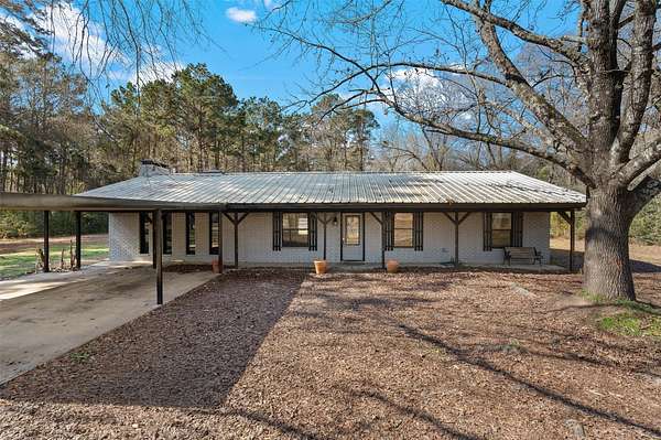1.77 Acres of Land with Home for Sale in Carthage, Texas