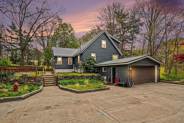 3 Acres of Land with Home for Sale in Norton Shores, Michigan