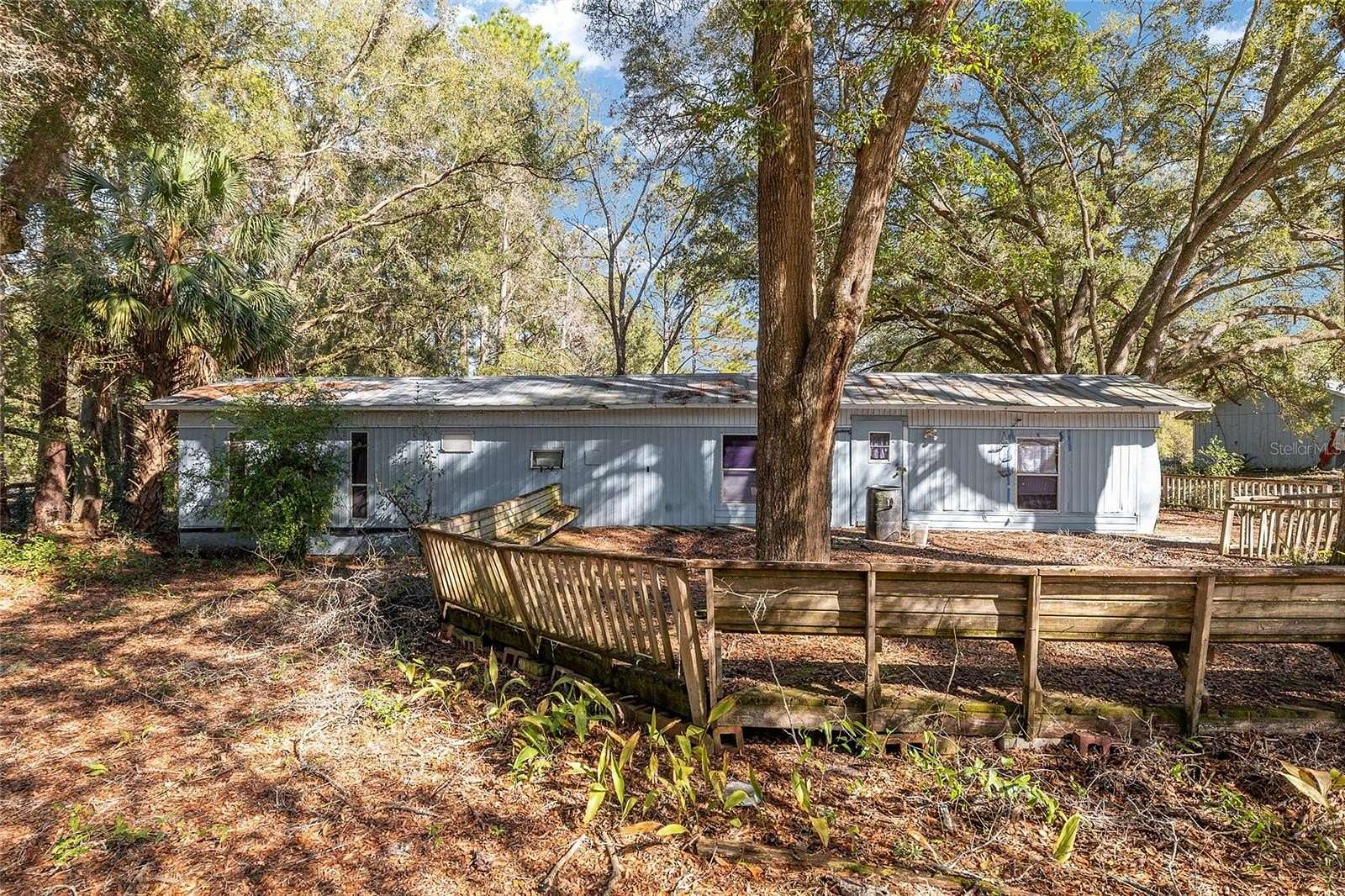5.56 Acres of Land with Home for Sale in Archer, Florida
