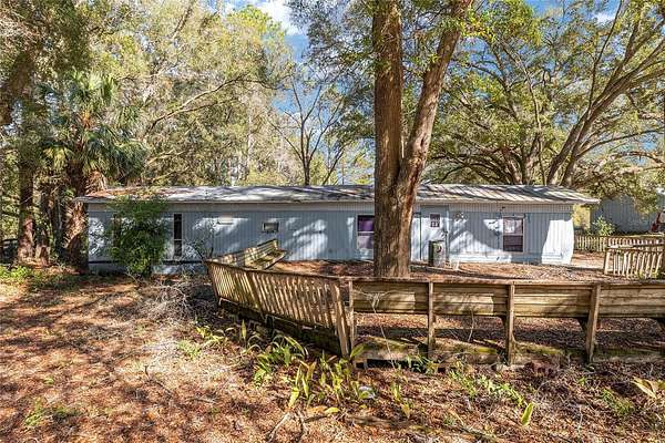 5.56 Acres of Land with Home for Sale in Archer, Florida