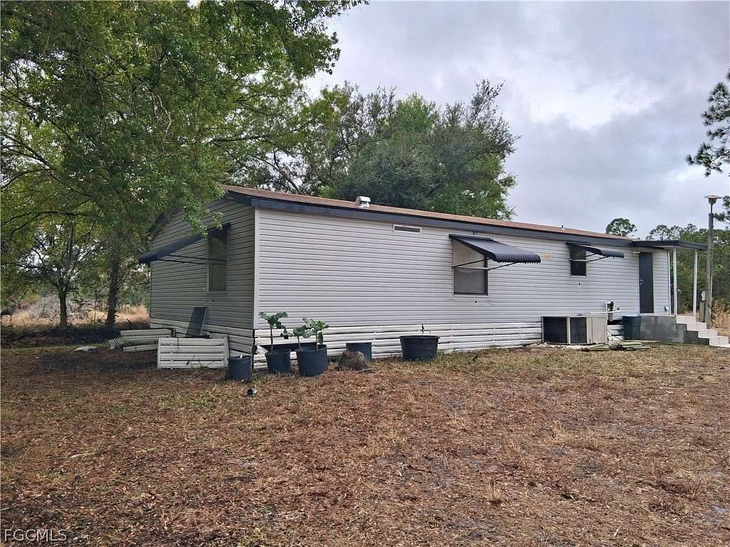 10 Acres of Residential Land with Home for Sale in Clewiston, Florida