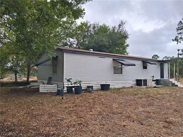 10 Acres of Residential Land with Home for Sale in Clewiston, Florida