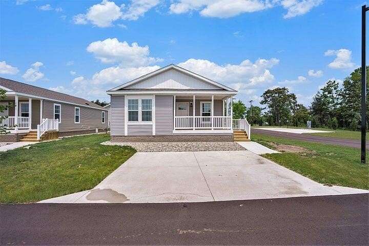 23.3 Acres of Land with Home for Sale in Norton Shores, Michigan