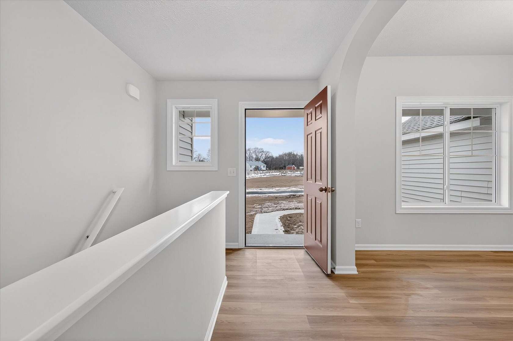 1.5 Acres of Land with Home for Sale in Rockford, Michigan