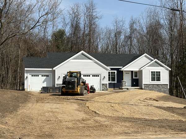 1.5 Acres of Land with Home for Sale in Rockford, Michigan