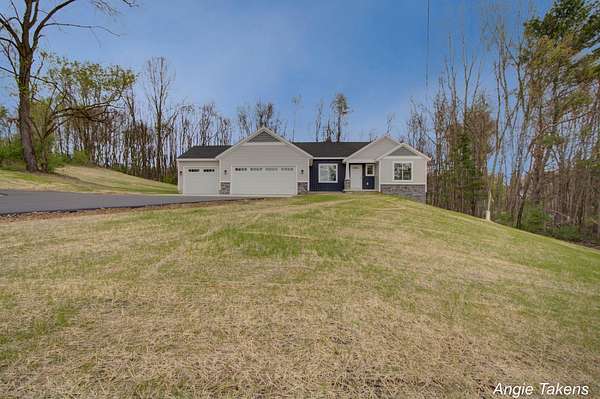 1.5 Acres of Land with Home for Sale in Rockford, Michigan