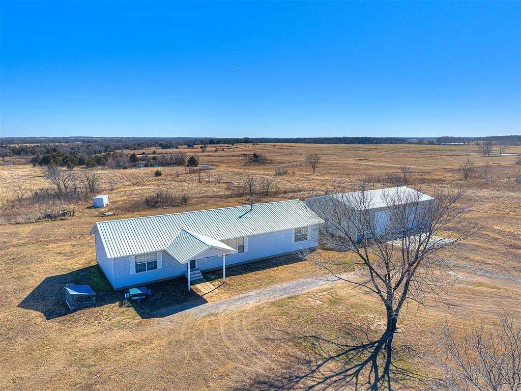 10 Acres of Residential Land with Home for Sale in Prague, Oklahoma