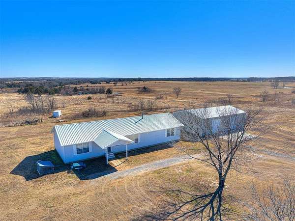10 Acres of Residential Land with Home for Sale in Prague, Oklahoma