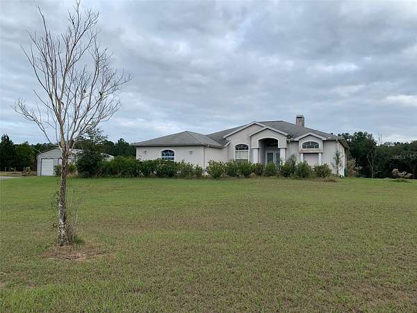 4.8 Acres of Residential Land with Home for Sale in Floral City, Florida