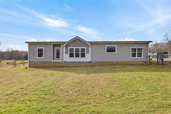 16.1 Acres of Land with Home for Sale in Canmer, Kentucky