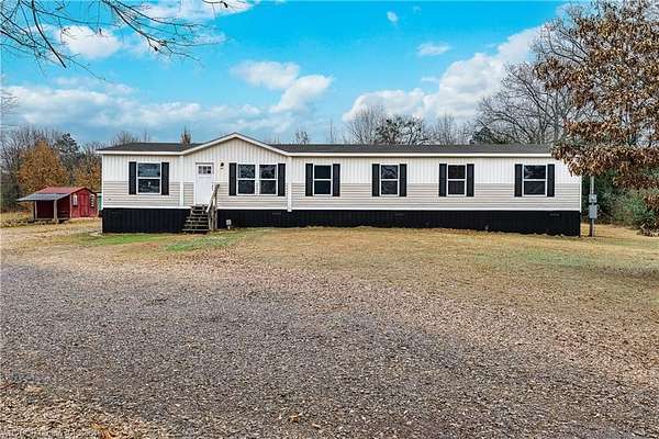 5 Acres of Residential Land with Home for Sale in Ozark, Arkansas