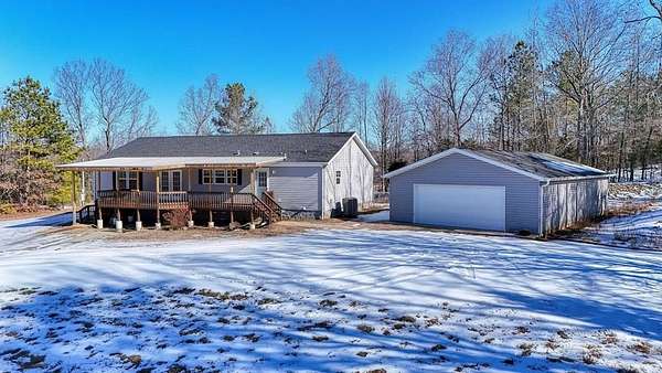 32.2 Acres of Recreational Land with Home for Sale in Puryear, Tennessee