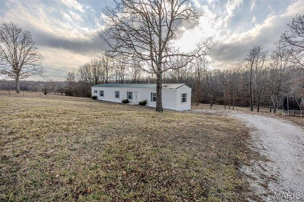 5.6 Acres of Land with Home for Sale in Phillipsburg, Missouri