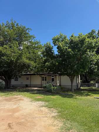 10 Acres of Recreational Land with Home for Sale in Hext, Texas