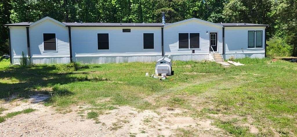 9.82 Acres of Land with Home for Sale in Sulphur Springs, Texas