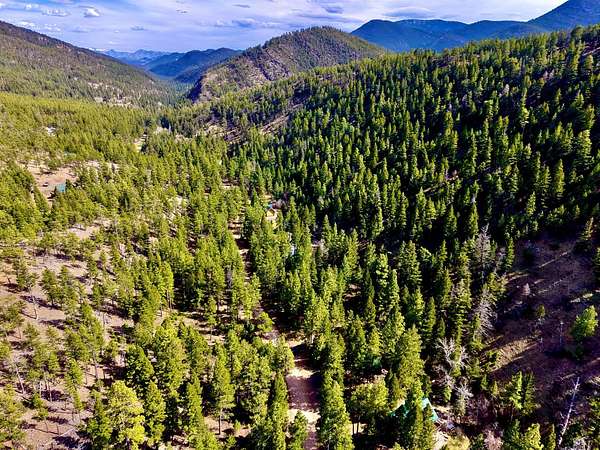 11.5 Acres of Recreational Land with Home for Sale in Wolf Creek, Montana