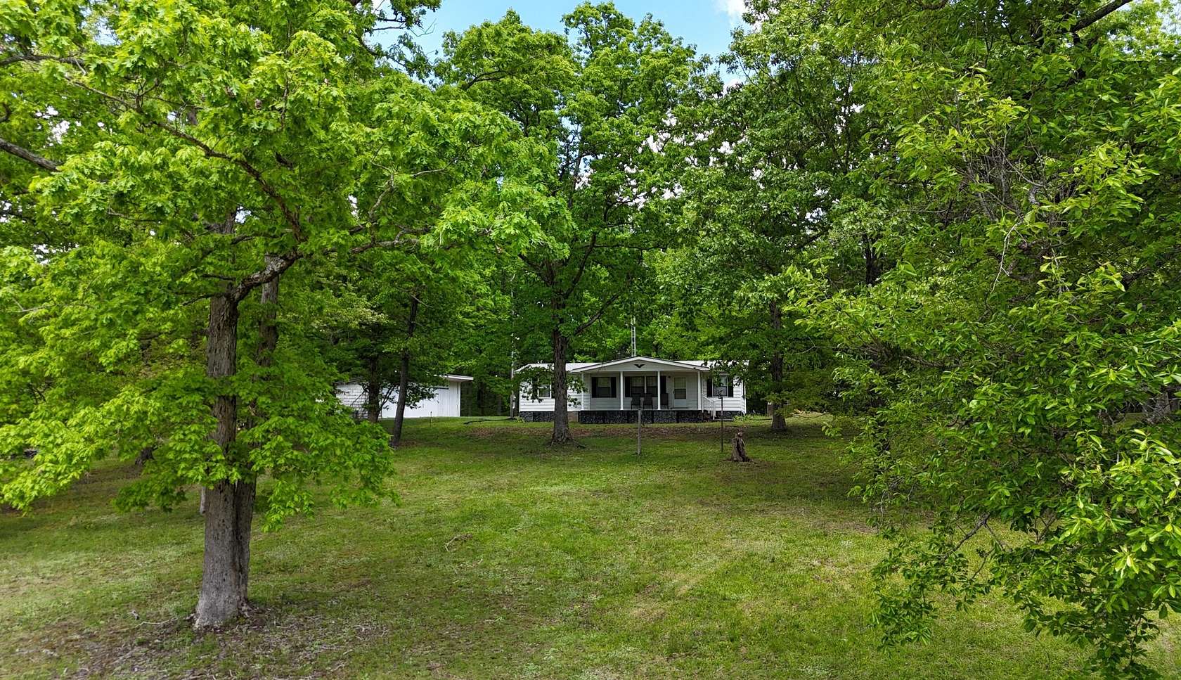 28.5 Acres of Land with Home for Sale in Irvine, Kentucky
