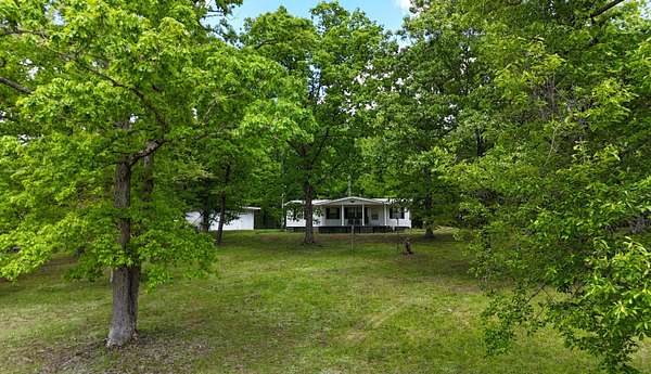 28.5 Acres of Land with Home for Sale in Irvine, Kentucky