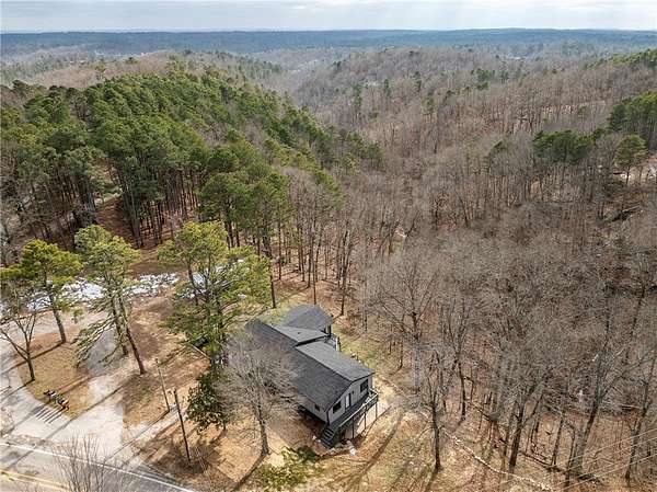 12 Acres of Recreational Land with Home for Sale in Rogers, Arkansas