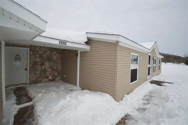 1.5 Acres of Residential Land with Home for Sale in Elmira, Michigan